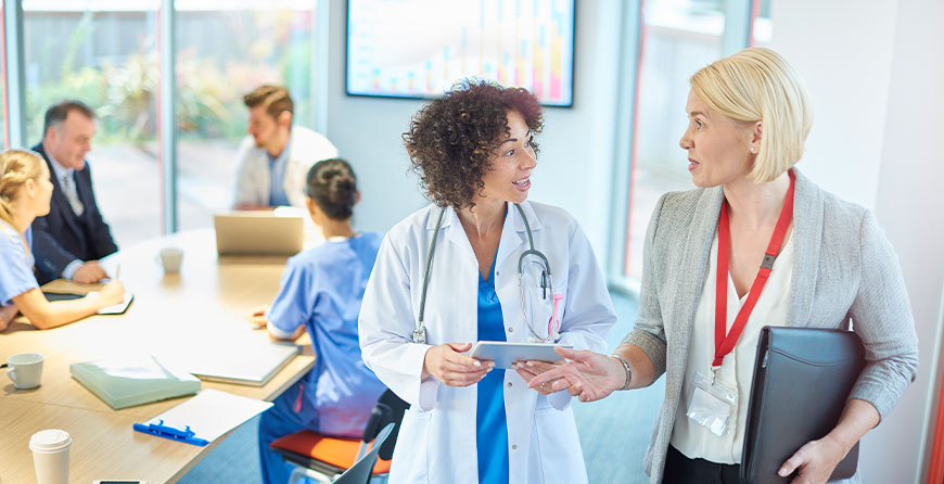 Doctor and business woman talking